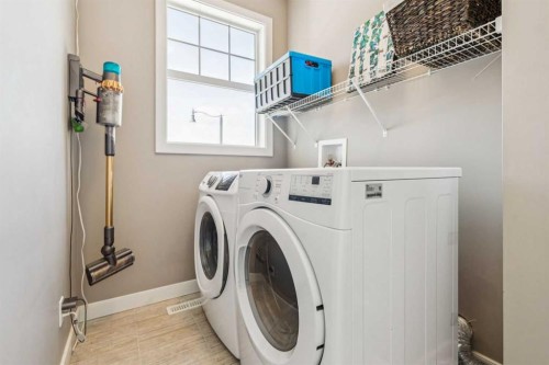 21 Riviera Point, Cochrane, AB - Indoor Photo Showing Laundry Room