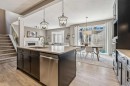 21 Riviera Point, Cochrane, AB  - Indoor Photo Showing Kitchen With Double Sink With Upgraded Kitchen 
