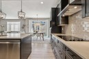 21 Riviera Point, Cochrane, AB  - Indoor Photo Showing Kitchen With Upgraded Kitchen 