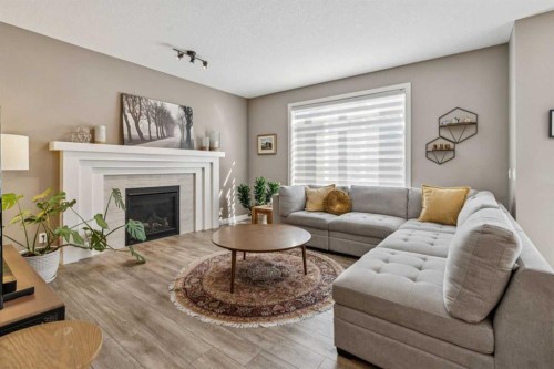21 Riviera Point, Cochrane, AB - Indoor Photo Showing Living Room With Fireplace