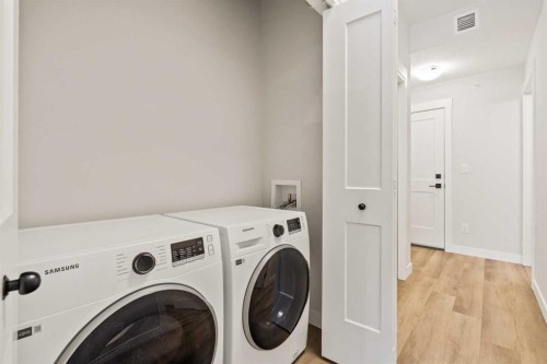 402-50 Sage Hill Nw, Calgary, AB - Indoor Photo Showing Laundry Room