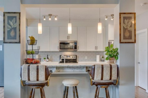 228 Sage Bluff Drive Nw, Calgary, AB - Indoor Photo Showing Kitchen With Upgraded Kitchen