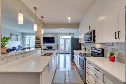 228 Sage Bluff Drive Nw, Calgary, AB - Indoor Photo Showing Kitchen With Double Sink With Upgraded Kitchen