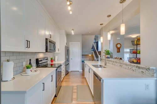 228 Sage Bluff Drive Nw, Calgary, AB - Indoor Photo Showing Kitchen With Double Sink With Upgraded Kitchen