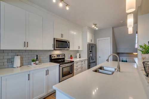 228 Sage Bluff Drive Nw, Calgary, AB - Indoor Photo Showing Kitchen With Double Sink With Upgraded Kitchen