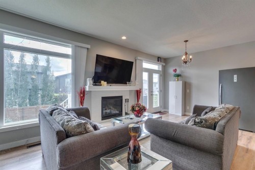 228 Sage Bluff Drive Nw, Calgary, AB - Indoor Photo Showing Living Room With Fireplace