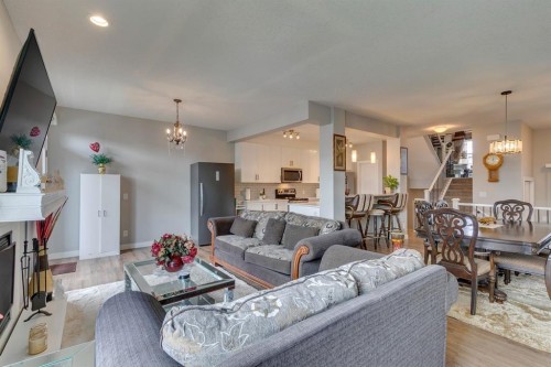 228 Sage Bluff Drive Nw, Calgary, AB - Indoor Photo Showing Living Room With Fireplace