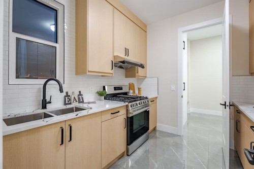 2057 Waterbury Road, Chestermere, AB - Indoor Photo Showing Kitchen With Double Sink With Upgraded Kitchen