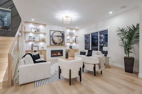 2057 Waterbury Road, Chestermere, AB - Indoor Photo Showing Other Room With Fireplace