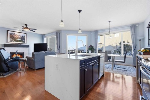 238 Sunset View, Cochrane, AB - Indoor Photo Showing Kitchen With Fireplace With Upgraded Kitchen