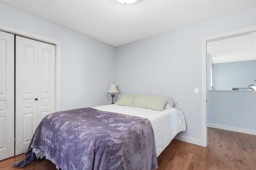 238 Sunset View, Cochrane, AB - Indoor Photo Showing Bedroom