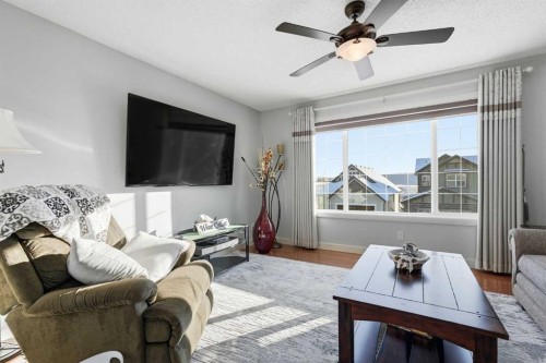 238 Sunset View, Cochrane, AB - Indoor Photo Showing Living Room