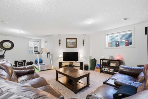 238 Sunset View, Cochrane, AB - Indoor Photo Showing Living Room