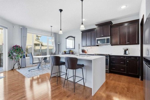 238 Sunset View, Cochrane, AB - Indoor Photo Showing Kitchen With Upgraded Kitchen