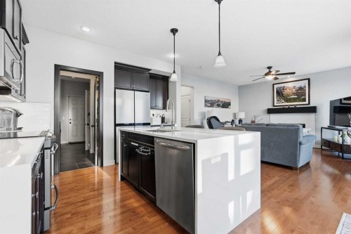 238 Sunset View, Cochrane, AB - Indoor Photo Showing Kitchen With Upgraded Kitchen