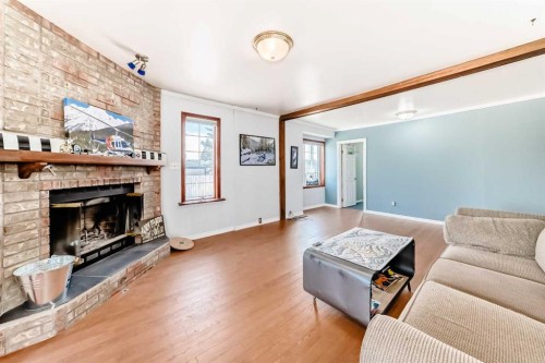 3 Cochrane Lake Trail, Cochrane Lake, AB - Indoor Photo Showing Living Room With Fireplace