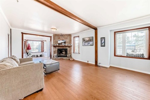 3 Cochrane Lake Trail, Cochrane Lake, AB - Indoor Photo Showing Living Room With Fireplace