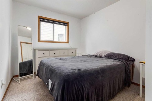 191 Panamount Heights Nw, Calgary, AB - Indoor Photo Showing Bedroom