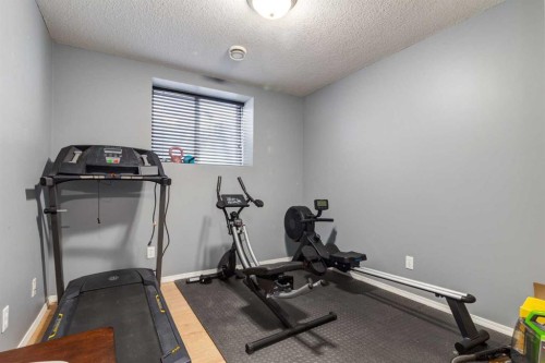 191 Panamount Heights Nw, Calgary, AB - Indoor Photo Showing Gym Room