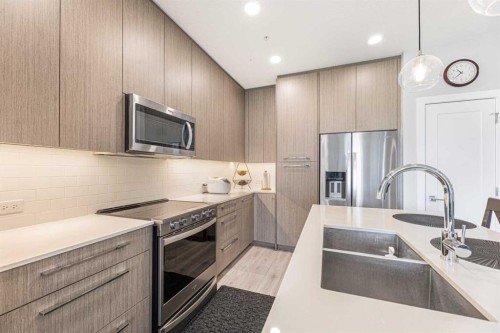 2126-76 Cornerstone Passage Ne, Calgary, AB - Indoor Photo Showing Kitchen With Stainless Steel Kitchen With Double Sink With Upgraded Kitchen