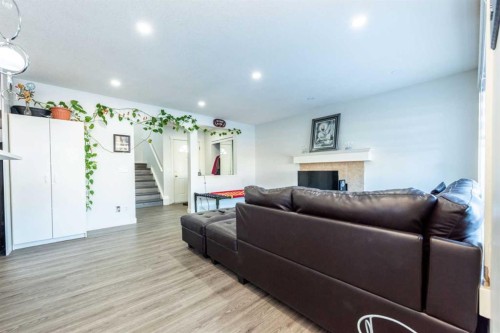 33 Marth'S  Meadow Place Ne, Calgary, AB - Indoor Photo Showing Living Room With Fireplace