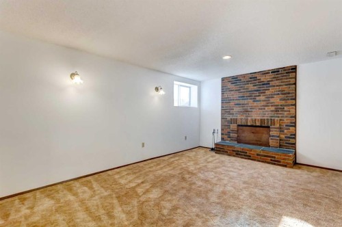 4620 31 Avenue Ne, Calgary, AB - Indoor Photo Showing Other Room With Fireplace