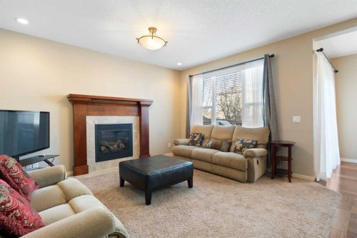 116 Brightoncrest Manor Se, Calgary, AB - Indoor Photo Showing Living Room With Fireplace