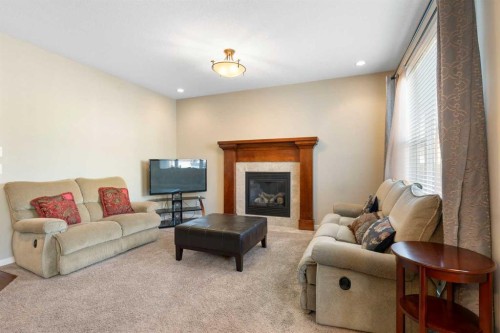116 Brightoncrest Manor Se, Calgary, AB - Indoor Photo Showing Living Room With Fireplace
