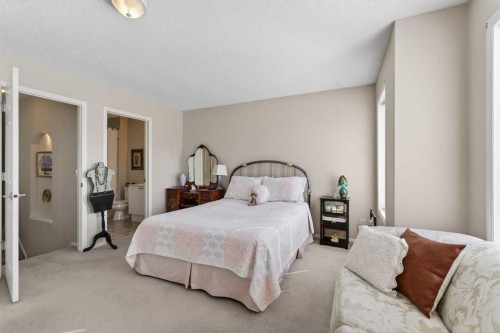 10 Cougar Ridge Bay Sw, Calgary, AB - Indoor Photo Showing Bedroom