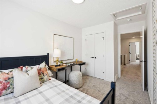 23 Heritage Heath, Cochrane, AB - Indoor Photo Showing Bedroom