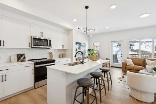 23 Heritage Heath, Cochrane, AB - Indoor Photo Showing Kitchen With Double Sink With Upgraded Kitchen