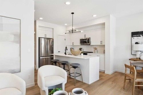 23 Heritage Heath, Cochrane, AB - Indoor Photo Showing Kitchen With Upgraded Kitchen