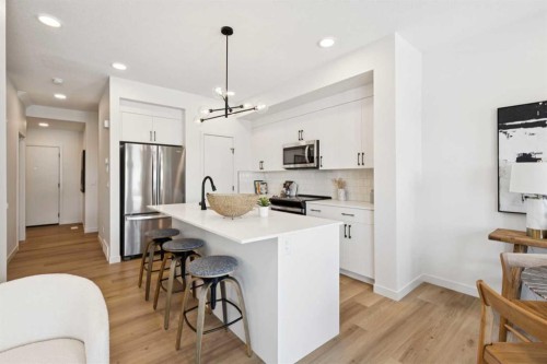 23 Heritage Heath, Cochrane, AB - Indoor Photo Showing Kitchen With Upgraded Kitchen