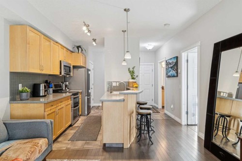 214-2 Hemlock Crescent Sw, Calgary, AB - Indoor Photo Showing Kitchen With Stainless Steel Kitchen