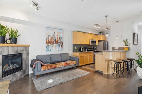 214-2 Hemlock Crescent Sw, Calgary, AB - Indoor With Fireplace