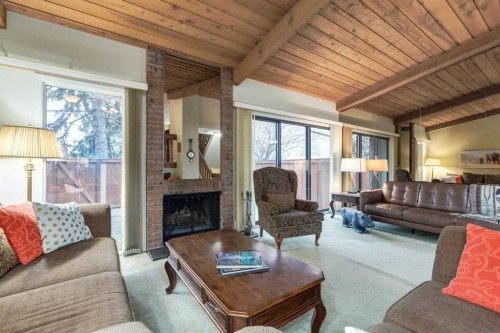 59-10030 Oakmoor Way Sw, Calgary, AB - Indoor Photo Showing Living Room With Fireplace