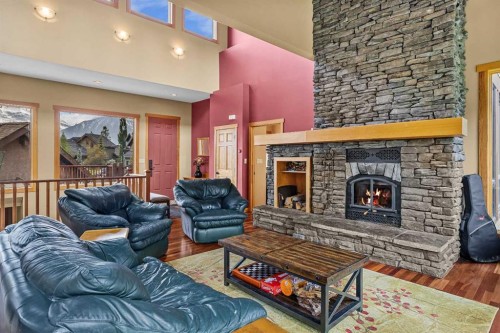 214 Eagle Point, Canmore, AB - Indoor Photo Showing Living Room With Fireplace