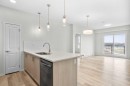 2411-33 Carringham Gate Nw, Calgary, AB  - Indoor Photo Showing Kitchen With Double Sink With Upgraded Kitchen 