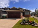 76 Riverside Way Se, Calgary, AB  - Outdoor With Facade 