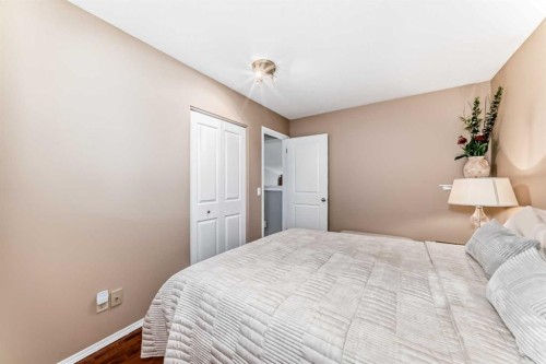 76 Riverside Way Se, Calgary, AB - Indoor Photo Showing Bedroom
