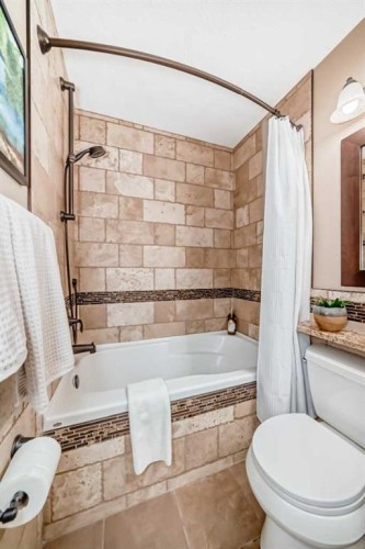 76 Riverside Way Se, Calgary, AB - Indoor Photo Showing Bathroom