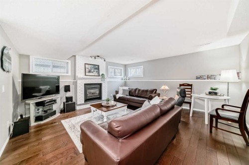 76 Riverside Way Se, Calgary, AB - Indoor Photo Showing Living Room With Fireplace
