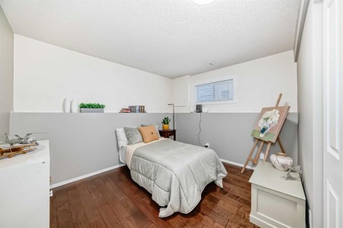 76 Riverside Way Se, Calgary, AB - Indoor Photo Showing Bedroom