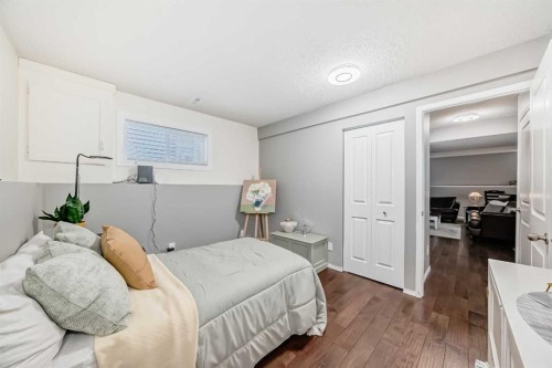 76 Riverside Way Se, Calgary, AB - Indoor Photo Showing Bedroom