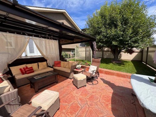 76 Riverside Way Se, Calgary, AB - Outdoor With Deck Patio Veranda With Exterior