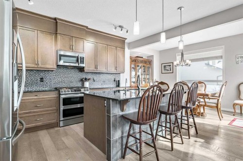 6 Drake Landing Loop, Okotoks, AB - Indoor Photo Showing Kitchen With Stainless Steel Kitchen With Upgraded Kitchen