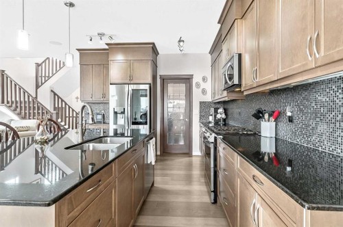 6 Drake Landing Loop, Okotoks, AB - Indoor Photo Showing Kitchen With Double Sink With Upgraded Kitchen
