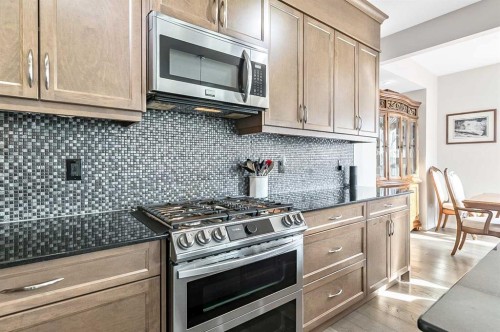 6 Drake Landing Loop, Okotoks, AB - Indoor Photo Showing Kitchen With Stainless Steel Kitchen With Upgraded Kitchen