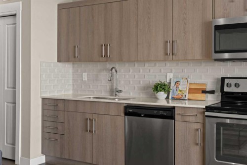 313-100 Auburn Meadows Common Se, Calgary, AB - Indoor Photo Showing Kitchen With Upgraded Kitchen