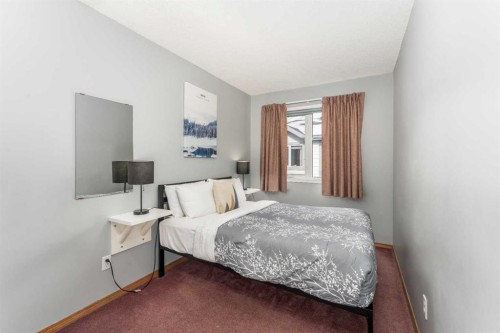 140-1202 Bow Valley Trail, Canmore, AB - Indoor Photo Showing Bedroom